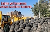 Zabıta yol kenarına bırakılan lastikler kaldırdı
