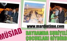 MÜSİAD  BAYRAMDA SURİYELİ ÇOCUKLARI GİYDİRDİ