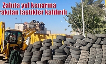 Zabıta yol kenarına bırakılan lastikler kaldırdı